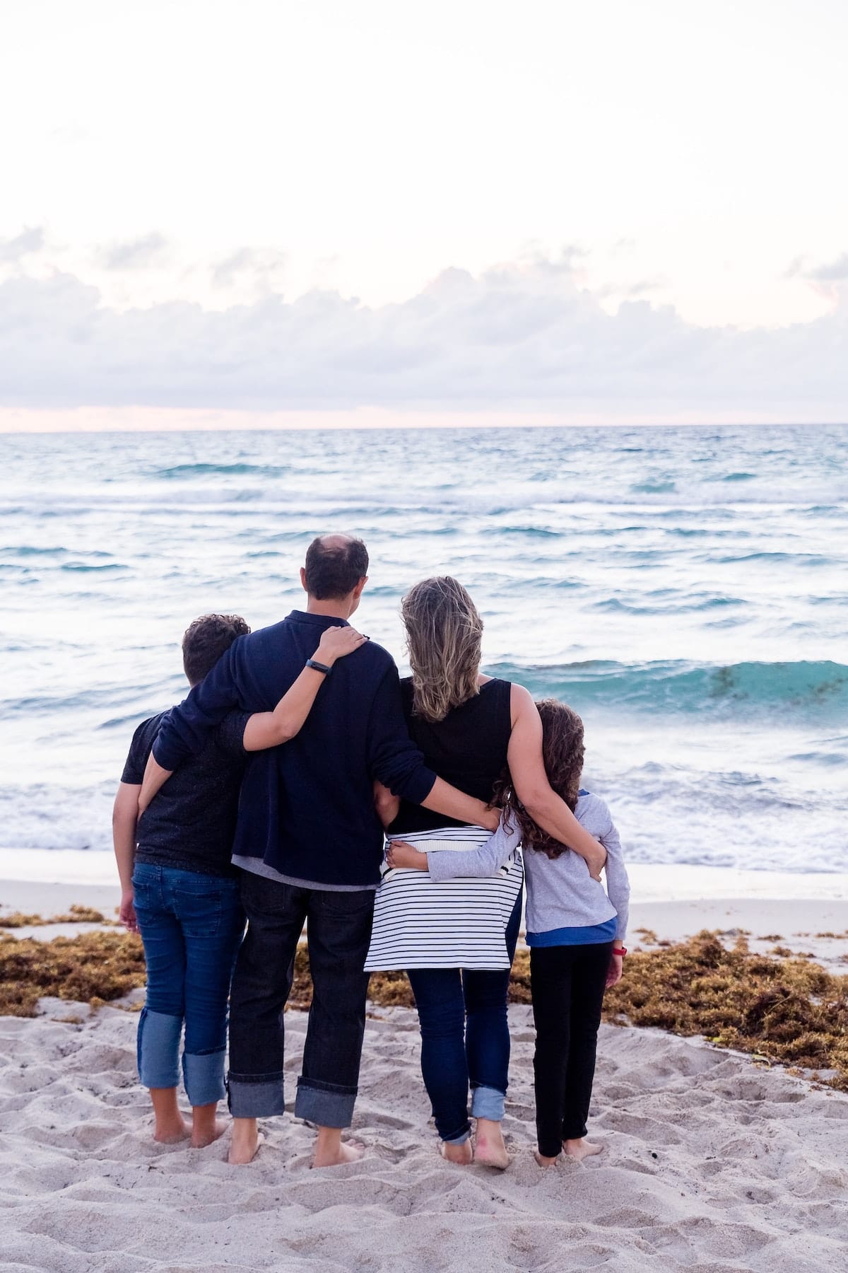 family looking at ocean